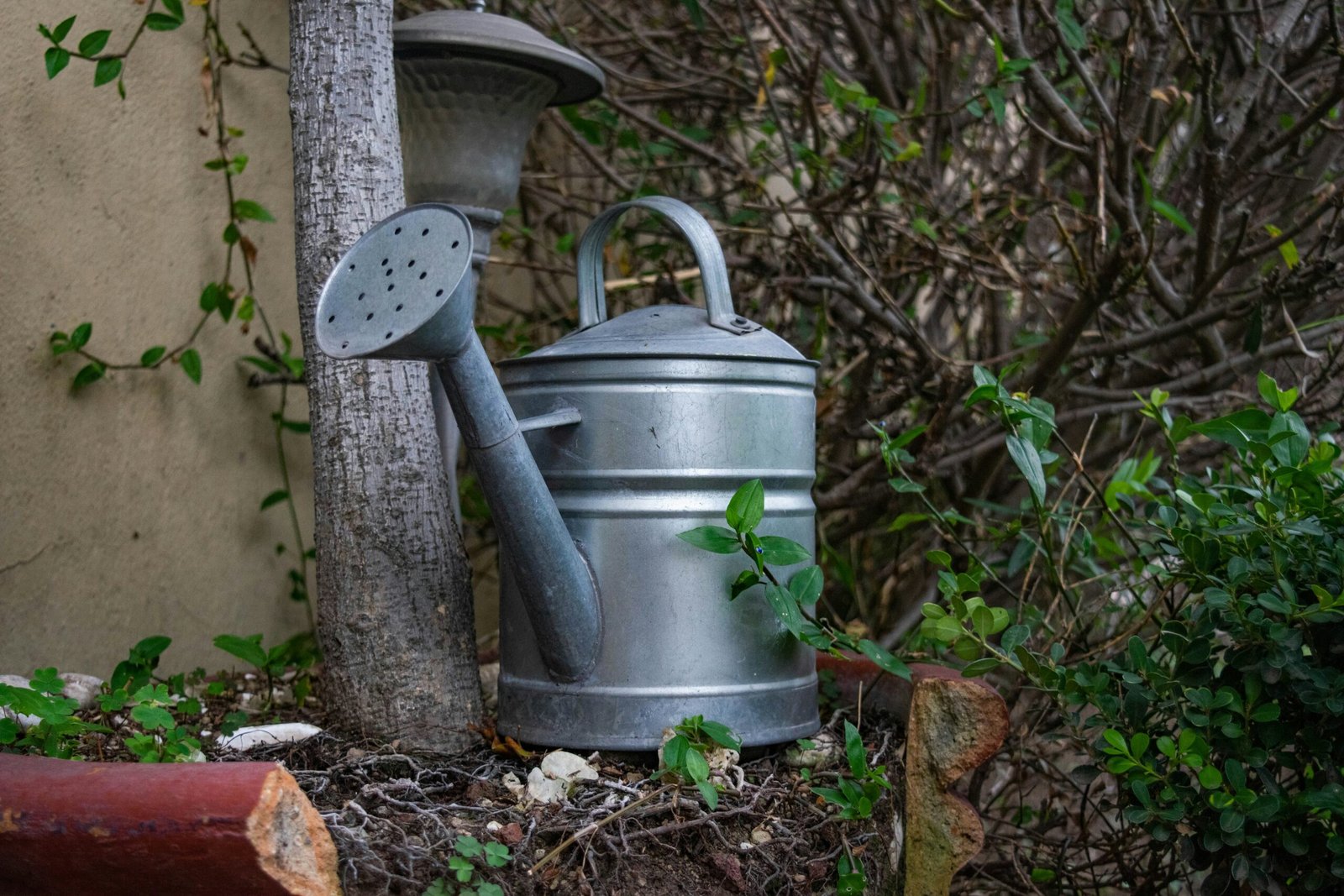 a metal bell on a pole